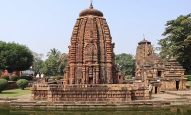 Odisha tour package — Konark Sun Temple chariot wheels at golden hour