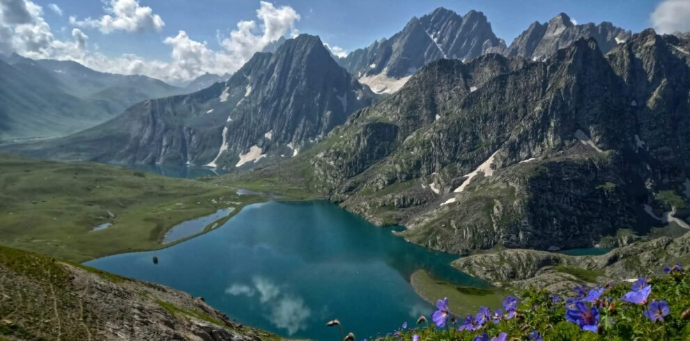 Kashmir tour package houseboat on Dal Lake at sunrise with Zabarwan mountains