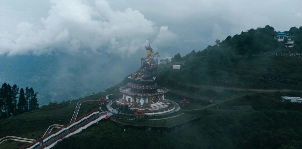 Sikkim Pelling Darjeeling tour — Pelling skywalk glass bridge over clouds with Kanchenjunga range behind