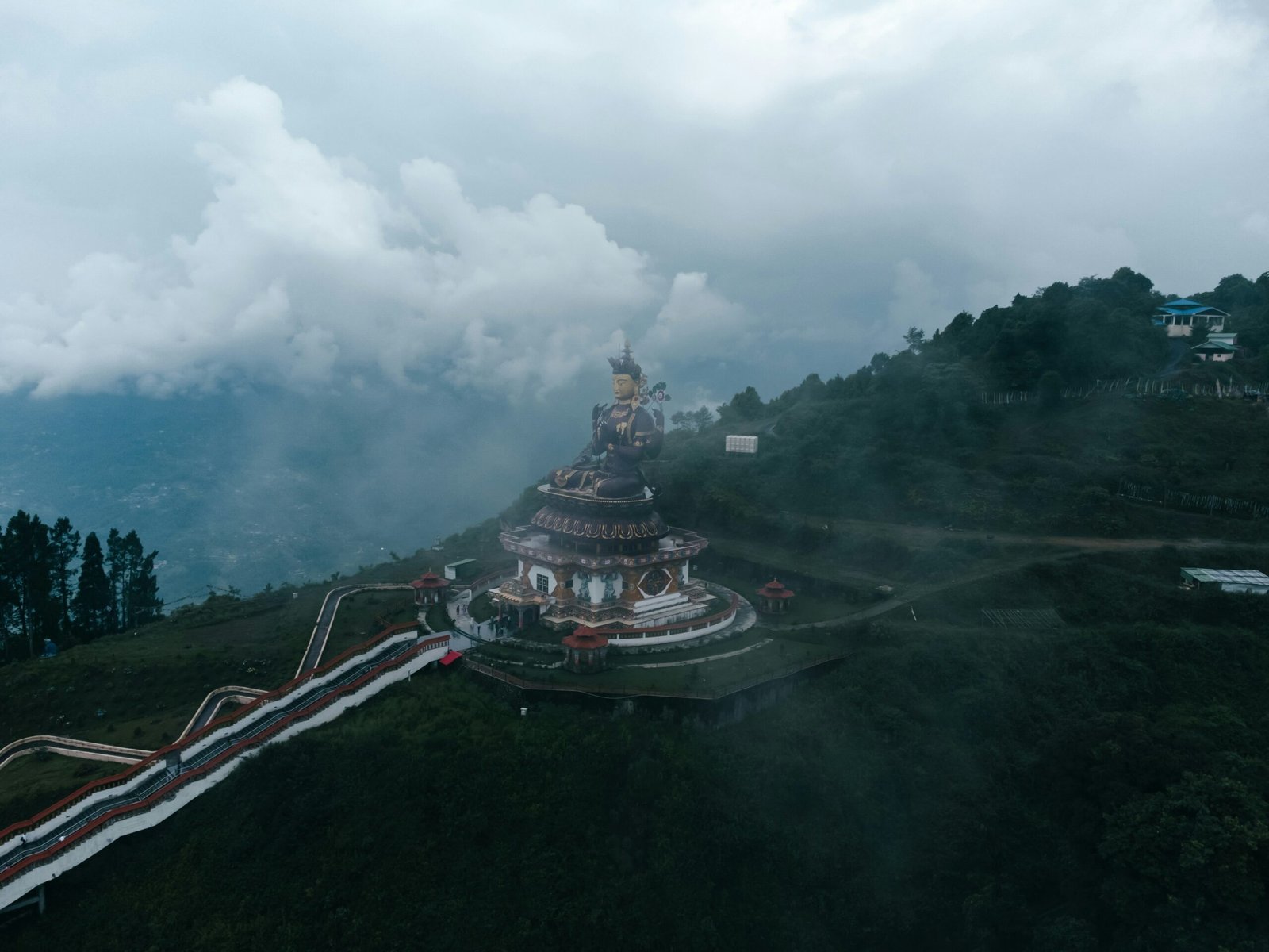 Sikkim Pelling Darjeeling tour — Pelling skywalk glass bridge over clouds with Kanchenjunga range behind